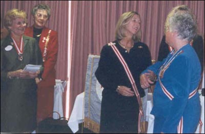 Susie Whitacre moves to the front row