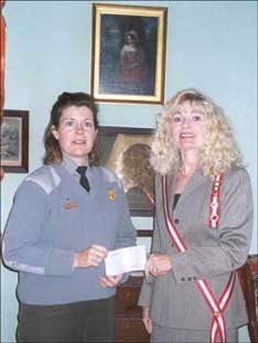 Mrs. Lougheed presents the check
